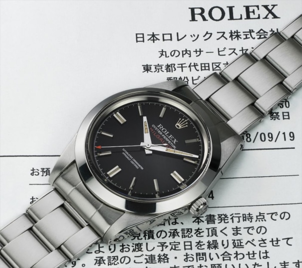 An extremely rare and very attractive stainless steel anti-magnetic wristwatch with center seconds and black dial